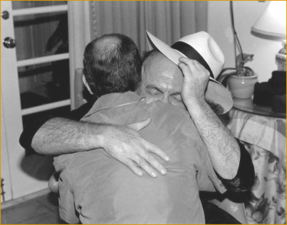 Terry receiving a hug from Adi Da Samraj when he gave him a hat He Loved
