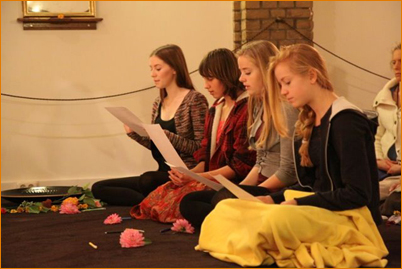 Four young devotees in a puja transitioning to the third stage of life