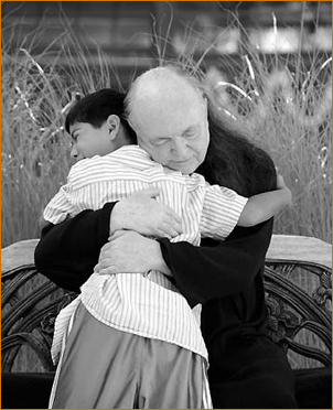 Adi Da embraces a young boy