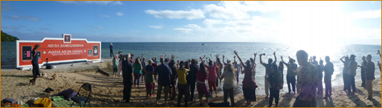 Devotees waving to Adi Da (in boat) on the beach of Adi Da Samrajashram
