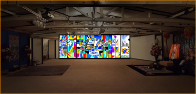 New 25 foot screen (showing Adi Da's Geome One) at Land Bridge Pavilion