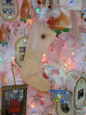 Closeup of tree decorations in Is-Da Happen, Adi Da Samrajashram, November 18, 2007. On this tree, each year of Adi Da's life is represented by an ornament with a photograph from that year.