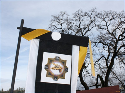 A Danavira Mela logo on a decorative banner: The Mountain Of Attention, December, 2014